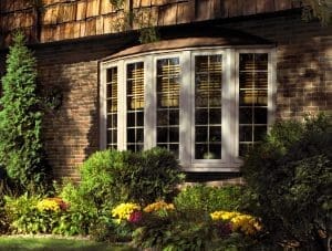 Window Styles Kaukauna WI Exterior of residence featuring bay window with white frames and brick walls